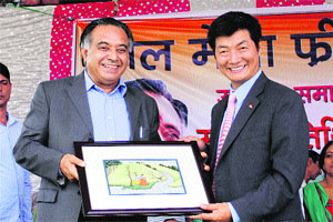 Tibetan PM Lobsang Sangay being honoured by state Transport Minister GS Bali in Nagrota Bagwan on Friday. 