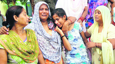 Inconsolable family members of jail inmate Sukhwinder Singh, who died in Kapurthala on Friday.