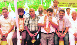 Industry representatives hold a protest against the e-trip system in Ludhiana on Friday. Tribune Photo: Himanshu Mahajan