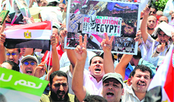 Mursis supporters take part in a rally in Alexandria on Friday.  AFP