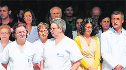 The staff of a hospital holds five minutes of silence to pay tribute to the victims of the train crash in Santiago de Compostela on Friday.  AFP