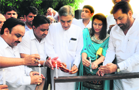 Pawan Kumar Bansal and local Congress leaders light candles at Sector 17 in Chandigarh on Saturday.