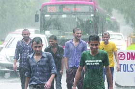 People seem to be enjoying the rain at Connaught Place in New Delhi on Saturday