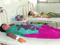 Schoolchildren get treatment at the General Hospital in Sirsa on Saturday