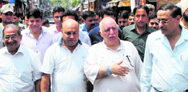 Abdul Majeed Wani, Minister of PWD, inspects the Raghunath market in Jammu on Saturday.