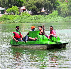 Tourists enjoy a boat ride at Mansar Lake in Udhampur.