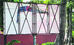A vacant hoarding alongside a city road in Ludhiana on Saturday. Photo: Inderjeet Verma