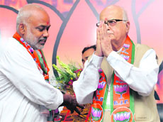 BJP leader LK Advani with president of the partys Scheduled Caste Front Sanjay Paswan (L) in New Delhi on Saturday. 
