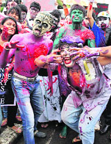 College students participate in a Zombie walk to highlight a social cause in Mumbai on Saturday.