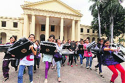 Students in a happy mood after receiving laptops from UP Chief Minister Akhilesh Yadav at a function in Lucknow on Saturday