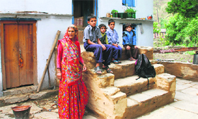 A family at their home in Dalar village inside the national park