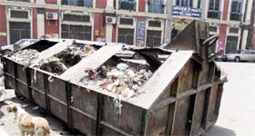 A garbage container in the city