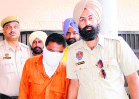 Police personnel with the accused in Amritsar on Sunday