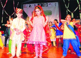RIOT OF COLOURS: Children perform a dance item at the Indian Academy of Fine Arts during the Summer Art Camp Festival, 2013, in Amritsar on Sunday