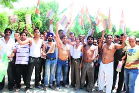Out on streets: Residents of Paras Ram Nagar staged a protest on Sunday against the rising food prices