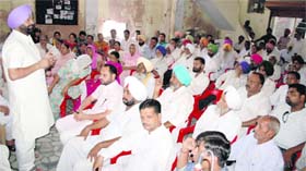 Former MLA Harminder Singh Jassi of the Congress addresses a party meeting in Bathinda