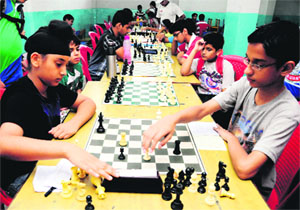 Students take part in a chess championship at St Xaviers School, Sector 44, in Chandigarh on Sunday.
