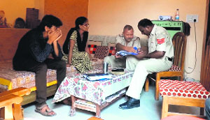 The police makes investigations at the victim's house in Kalka on Sunday.