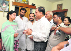 Congress councillors with accident victim Harpreet Singh Sodhis wife at her residence in Sector 45, Chandigarh, on Sunday.