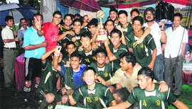 Kasiga School football team with the trophy after winning the Hemwati Nandan Bahuguna Memorial Football Tournament played at the Marshal School grounds in Jogiwala, Dehradun, on Sunday. 