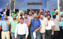 Computer teachers hold a protest rally in Jalandhar on Sunday. 