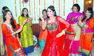 Festive delight: Members of the Femina Club perform during the Teej celebrations in Jalandhar. 