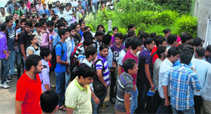 Aspirants outside the Government Women College, Gandhi Nagar, in Jammu on Sunday.
