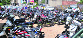Cars and two-wheelers parked outside a shopping mall near Bhai Bala Chowk on Ferozepur Road in Ludhiana on Sunday.