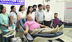 A volunteer donates blood at Shri Krishna Charitable Hospital in Ludhiana.