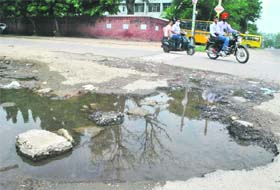 A large pothole on a road at Punjabi Bagh in Patiala