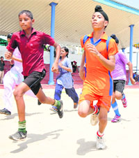 Candidates take part in physical proficiency test as part of the trials for lateral entry to Sports School, Ghudda.