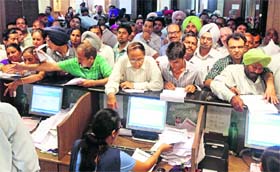 Rush at IT returns counters at Sector 17 in Chandigarh on Monday