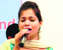 Singer Sonia Anand sings a bhajan in memory of flood victims at a function in Dehradun on Monday. 