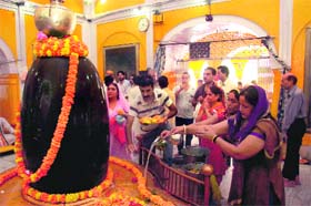 Offering prayers: Devotees throng a Shiv temple in Jammu on the occasion of the first Monday of Shravan