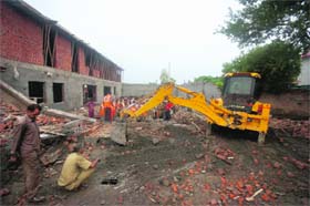 Rescue operations being undertaken at the site of the collapse at Barnai on Jammus outskirts on Monday