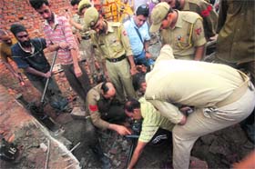 Rescue operations being undertaken at the site of the collapse at Barnai on Jammus outskirts on Monday