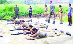 Girl cadets of NCC practicing shooting during a NCC camp at the shooting range of Kanya Mahavidyalya in Jalandhar on Monday.