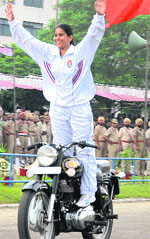 A woman constable of Punjab police displaying stunt on a motorbike at the PAP complex in Jalandhar on Monday