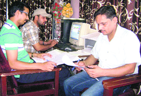 Staff of a school at Ahmedgarh upload the data.