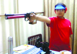 Malaika Goel aims at a target.