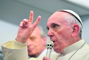 Pope Francis speaks at a press conference aboard the flight to Italy from Brazil on Sunday. 