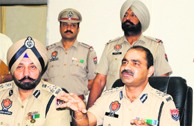 Police Commissioner Ram Singh and DIG (Border Range) Paramraj Singh Umranangal hold a joint press conference in Amritsar on Tuesday.