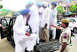 The girls family members and associates being taken to the Civil Lines police station after they created ruckus at the District Courts in Bathinda on Tuesday