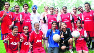 Members of the football team of Govt Model Sr Sec School, Sector 22, strike a pose after winning the Inter-School Girls Football Tournament in Chandigarh on Tuesday.