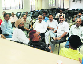 Supporters and relatives of councillors wait for the MC meeting to end at the Mini-Secretariat in Panchkula on Tuesday.