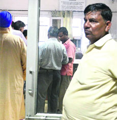 Her father at the GMSH-16, where her postmortem was conducted on Tuesday.