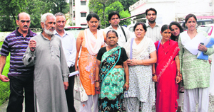 A delegation of the Uttarakhand Kranti Dal (UKD) Panwar faction demands action against the rival faction outside the office of the Inspector-General of Police in Dehradun on Tuesday.