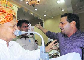 A supporter of a faction leader shouts as HPCC president Phool Chand Mullana addresses party workers at Narnaul (Mahendragarh) on Tuesday