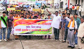 Students, staff and villagers hold a rally in Kangra town on Tuesday.