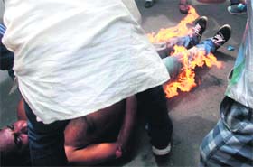 A Gorkha People's Liberation Front supporter attempts self-immolation in Kalimpong, near Siliguri, on Tuesday